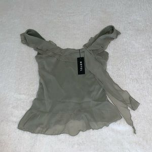 Elegant ruffle top in olive green